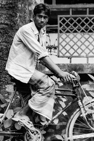 Young man riding bicycle
