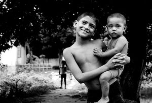 boy holding little brother