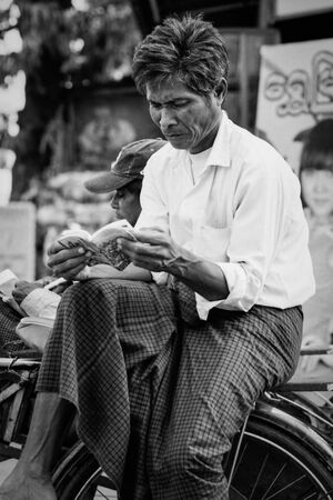 Man reading book on Saiq-ka