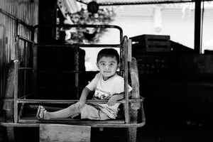 Boy relaxing on cart