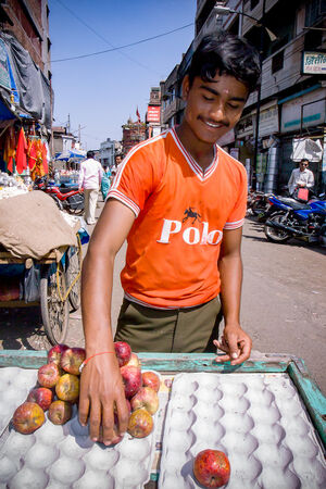 Young man selling apples