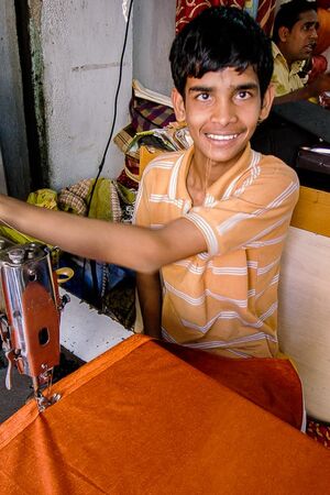 Boy sewing