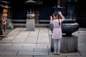 Girl beside incense burner