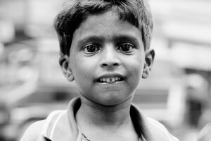 Boy biting bottom lip