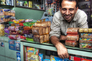 Storekeeper leaning out from counter