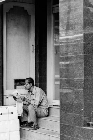 Man reading newspaper