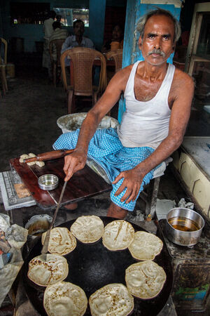 Man baking Roti