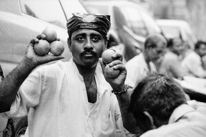 Man having oranges in hands