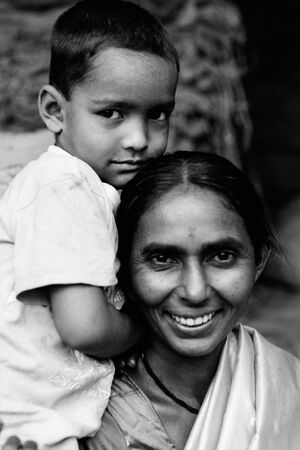 smiling mother and bashful son