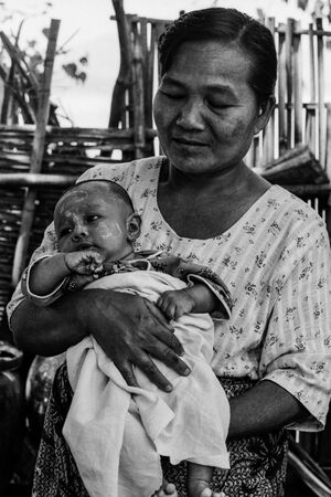 Older woman holding baby