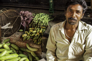 Man selling cucumbers