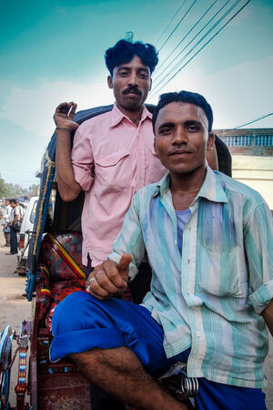 Two men chatting on cycle rickshaw