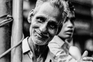 Man smiling in waggish mood
