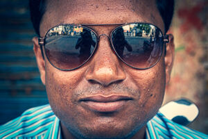 Figure reflected on sunglasses