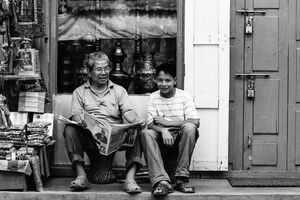 Father and son sitting together