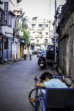 Man sleeping by roadside
