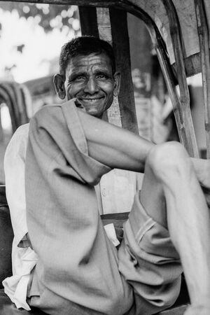 Gentle smile of rickshaw wallah