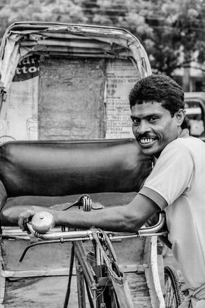 Bashful smile of rickshaw wallah
