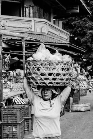 Woman carrying big basket
