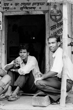 Men drinking a cup of chai