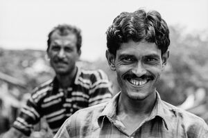Smiling man and uninterested man