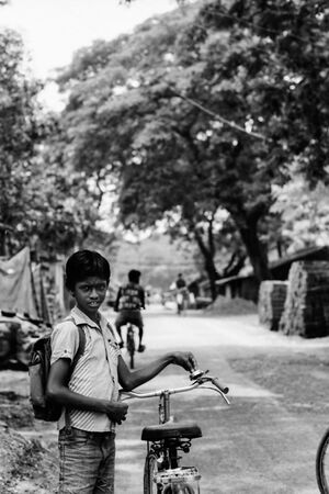 Boy standing by roadside