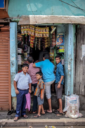 men in front of shop