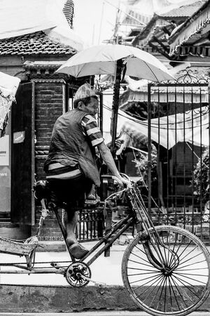Rickshaw wallah on saddle