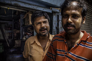 Two men in storefront