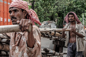Men pushing cart