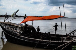 Men in a boat moored in the Hooghly River