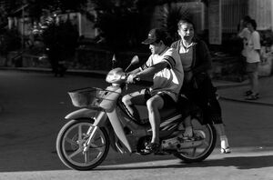 Husband and wife on a motorbike