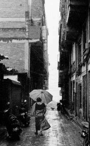 Woman walking in hard rain