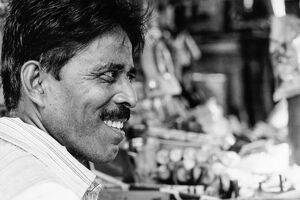Profile of a grinning man