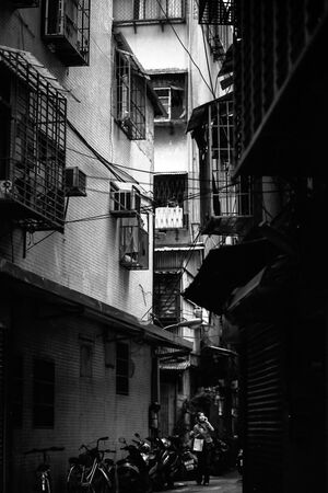 Woman in dim lane