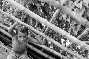Boy climbing framework