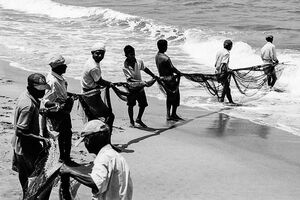 Fishermen dragging fishnet