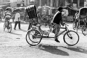 Cycle rickshaw running street