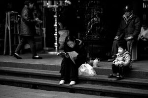 Woman and boy in precinct