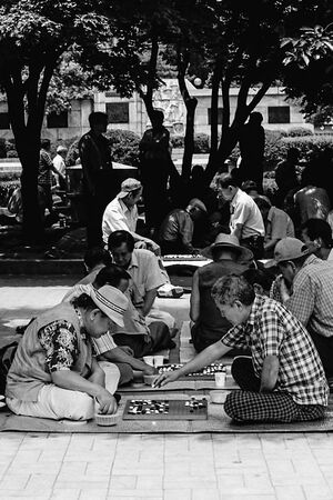 Men playing Go under the sky