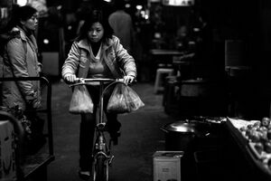 Woman pedaling bicycle