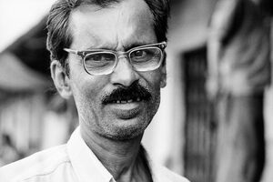 Man wearing psychedelic glasses