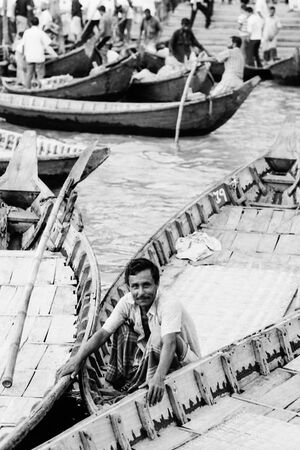 Man crouching on boat