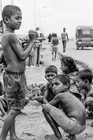 Children playing by roadside