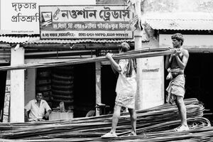 Men carrying reinforcing steels