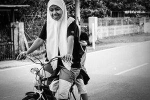 Girl pedaling bicycle