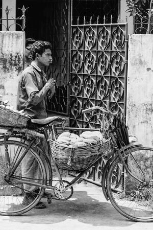 Man peddling bananas