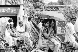 Parent and child on cycle rickshaw