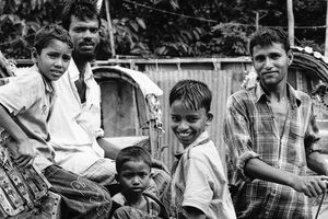 Men and boys around cycle rickshaw