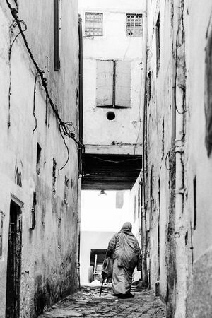 Older woman walking the lane